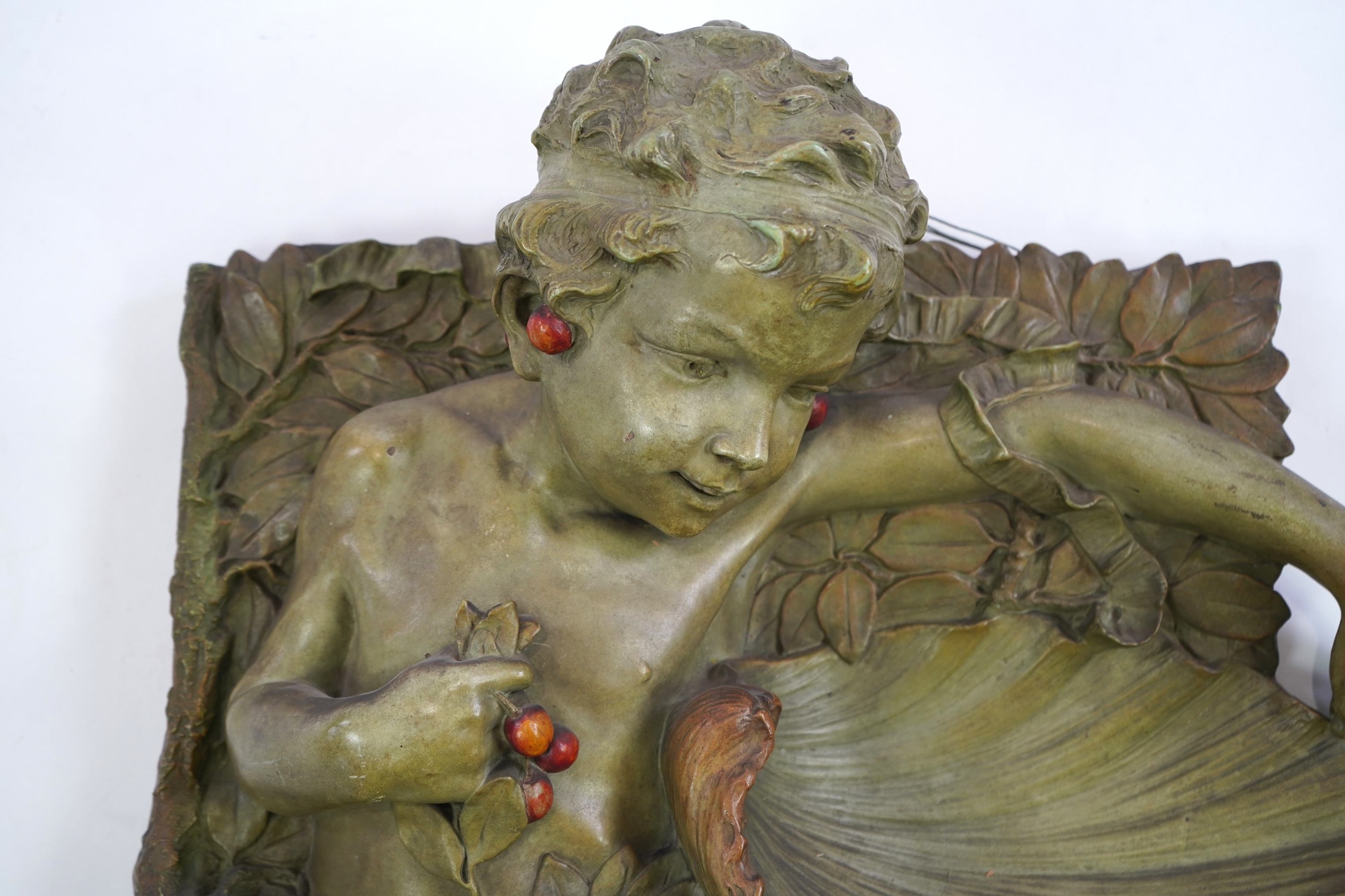 A large Austrian cold painted terracotta wall plaque, by J. Pilar, c.1900